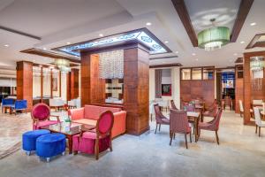 a lobby of a hotel with tables and chairs at Villa Side Hotel in Side