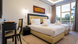 Postel nebo postele na pokoji v ubytování Hotel Al Walid + 91 fotografií