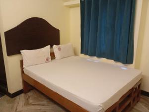 En eller flere senge i et værelse på Thirumala palace