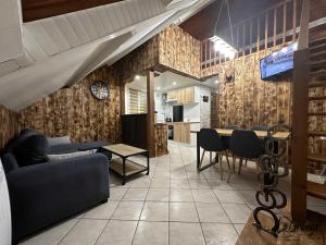 a living room with a couch and a table at La Grange in Carentan +11 photos