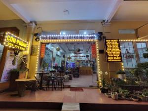 an entrance to a restaurant with tables and chairs at Minh Hưng Hostel in Sa Pa +89 photos