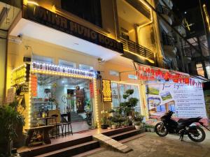 a motorcycle parked in front of a store at Minh Hưng Hostel in Sapa
