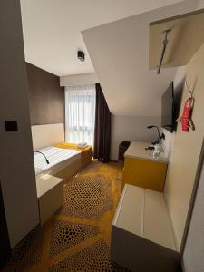 Ένα ή περισσότερα κρεβάτια σε δωμάτιο στο Eclipse Budget Rooms