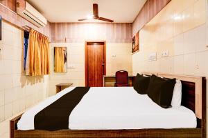 Postel nebo postele na pokoji v ubytování Hotel O MIZPAH INN + 21 fotografií