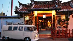 an old van parked in front of a building at Ringo's Foyer in Malacca