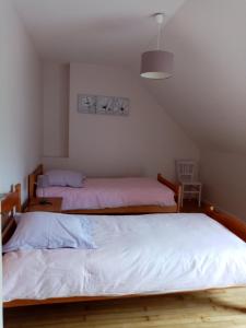 Postel nebo postele na pokoji v ubytování Au Beau Gîte