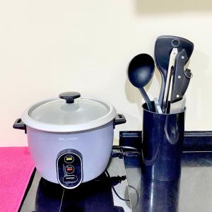 a pot sitting on top of a counter with utensils at Urban Oasis in Cagayan de Oro City in Cagayan de Oro +15 photos