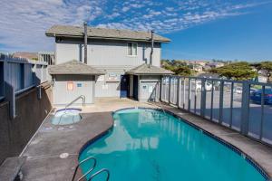 a swimming pool on the balcony of a house at NYE Beach Haven Studio in Newport