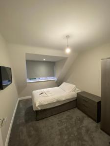 Postel nebo postele na pokoji v ubytování Cavendish Apartments