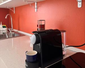a coffee maker on a counter in a kitchen at Be Your Home - Cruise Stop Guest House in Civitavecchia