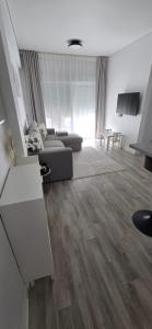 a living room with a couch and a table at Apartamentos playa Romanilla in Roquetas de Mar