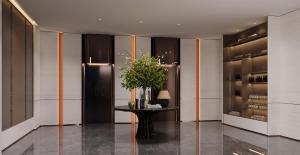 a room with a table with a plant on it at From K Guangshi Hotel-XIAOBEI Metro Branch in Guangzhou