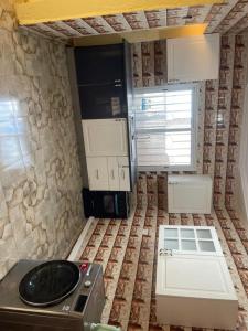 a kitchen with a stove and a counter top at Ebreezy1 villa 2 in Brufut
