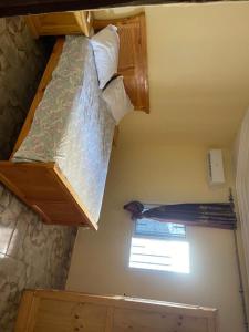 a bed in a room with a window at Ebreezy1 villa 2 in Brufut