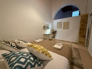 a bedroom with two beds with pillows on them at Evdokia Old Town Hotel in Rhodes Town