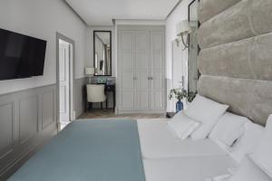 Postel nebo postele na pokoji v ubytování MIM Ibiza Member of Melia Collection + 40 fotografií