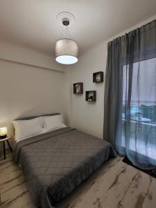 Ένα ή περισσότερα κρεβάτια σε δωμάτιο στο Casa Napie Ioannina