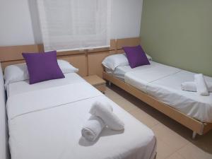 Postel nebo postele na pokoji v ubytování Apartamento en magic world Oropesa del mar + 11 fotografií