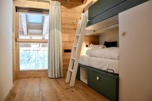 Ένα ή περισσότερα κρεβάτια σε δωμάτιο στο Chalet Chinaille A2 – L’Écrin du Grand-Bornand