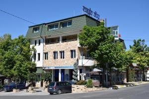 a building on the side of a street at Guest Rooms Lina in Kirkovo