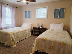 Postel nebo postele na pokoji v ubytování Gather at the Cape