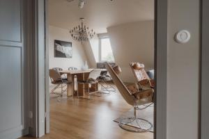 a dining room with a table and chairs at TwentySix in Malmö +53 photos
