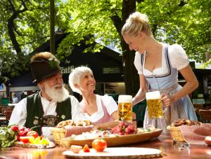 a group of people sitting at a table with beer at Arcaden Apartment in Regensburg