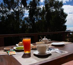 a table with a drink and plates of food on it at La Parada 