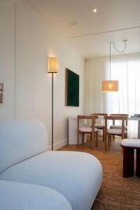 a room with a table and a dining room at Hotel Montaigne in Ostend