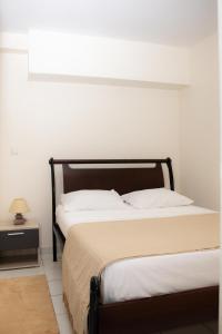 Ένα ή περισσότερα κρεβάτια σε δωμάτιο στο Gosier séjour