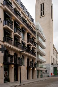 a building with balconies on the side of a street at Hotel Montaigne in Ostend +54 photos