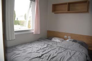 Ένα ή περισσότερα κρεβάτια σε δωμάτιο στο Chez lolo 7 à 8 personnes