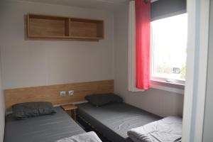 Ένα ή περισσότερα κρεβάτια σε δωμάτιο στο Chez lolo 7 à 8 personnes