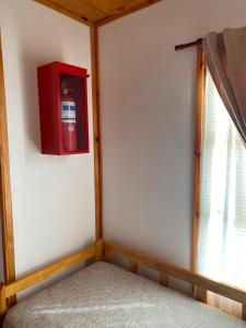 a corner of a room with a red box on the wall at La Vita CdelU in Concepción del Uruguay +12 photos