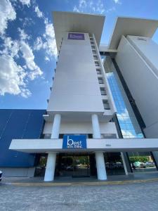 a building with a sign in front of it at Best Hotel Sobral in Sobral