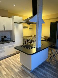 a kitchen with a counter top and a dining room at Linsell in Sveg +28 photos