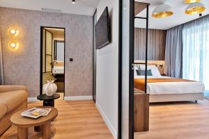 Ένα ή περισσότερα κρεβάτια σε δωμάτιο στο Acropolis Grid Athens