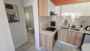 Η κουζίνα ή μικρή κουζίνα στο Luxury Apartment in Somerset West +21 φωτογραφίες
