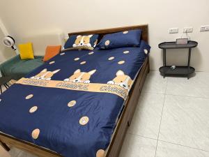 Ένα ή περισσότερα κρεβάτια σε δωμάτιο στο 日曜居