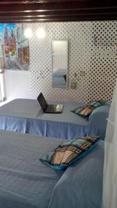 Katil atau katil-katil dalam bilik di Loft Centro Histórico Arucas