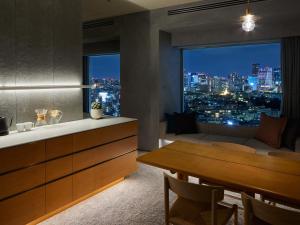 a kitchen and living room with a view of the city at sequence MIYASHITA PARK - Shibuya in Tokyo +42 photos