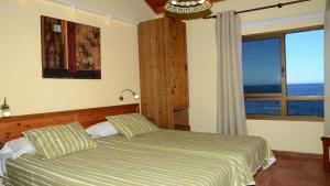 Ένα ή περισσότερα κρεβάτια σε δωμάτιο στο Casa Camilo II