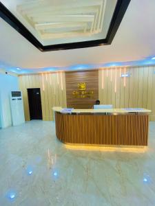 a lobby with a reception desk in a building at Chateux de atlantique Hotel in Lagos