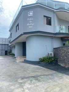 a building with a sign on the side of it at Chateux de atlantique Hotel in Lagos