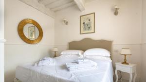 Ένα ή περισσότερα κρεβάτια σε δωμάτιο στο Domus Nannini SPA - L' Arco di Matteotti