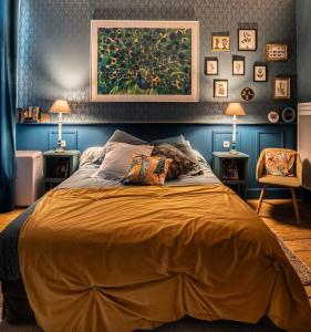 a bedroom with a large bed with two tables at Le Petit Couvent in LʼIsle-en-Dodon