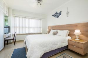 Postel nebo postele na pokoji v ubytování Oceanview Holiday Apartments + 34 fotografií