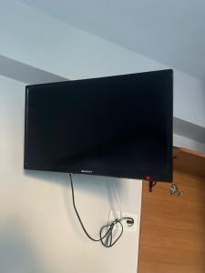 a flat screen tv hanging on a wall at NR1 Pansiyon in Canakkale