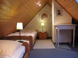 Postel nebo postele na pokoji v ubytování Ferienhaus Nes Pük