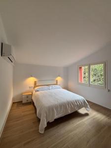 Ένα ή περισσότερα κρεβάτια σε δωμάτιο στο La Caseta de l'Adela